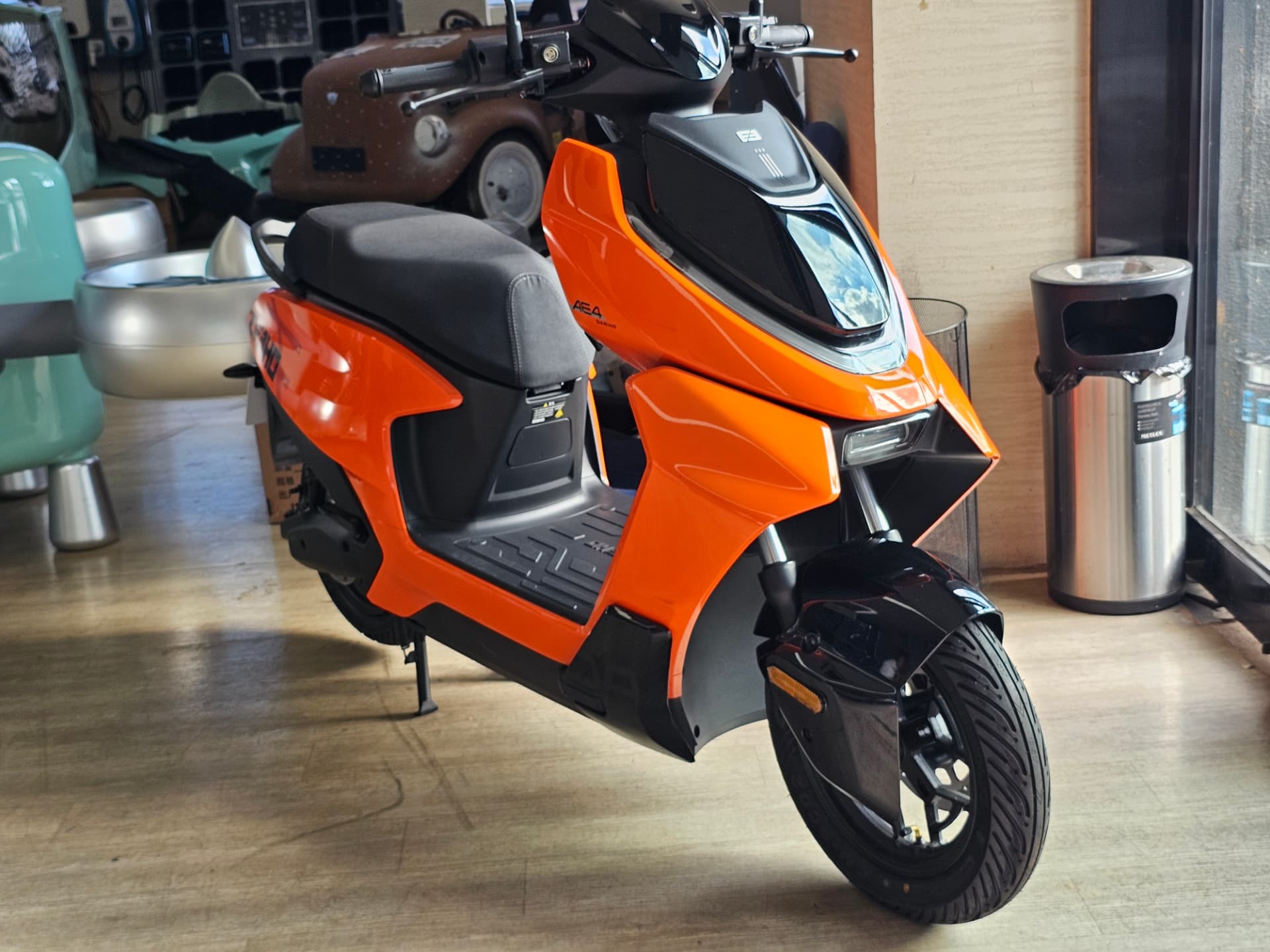 Electric scooter with moulded painted body panels and integrated lighting