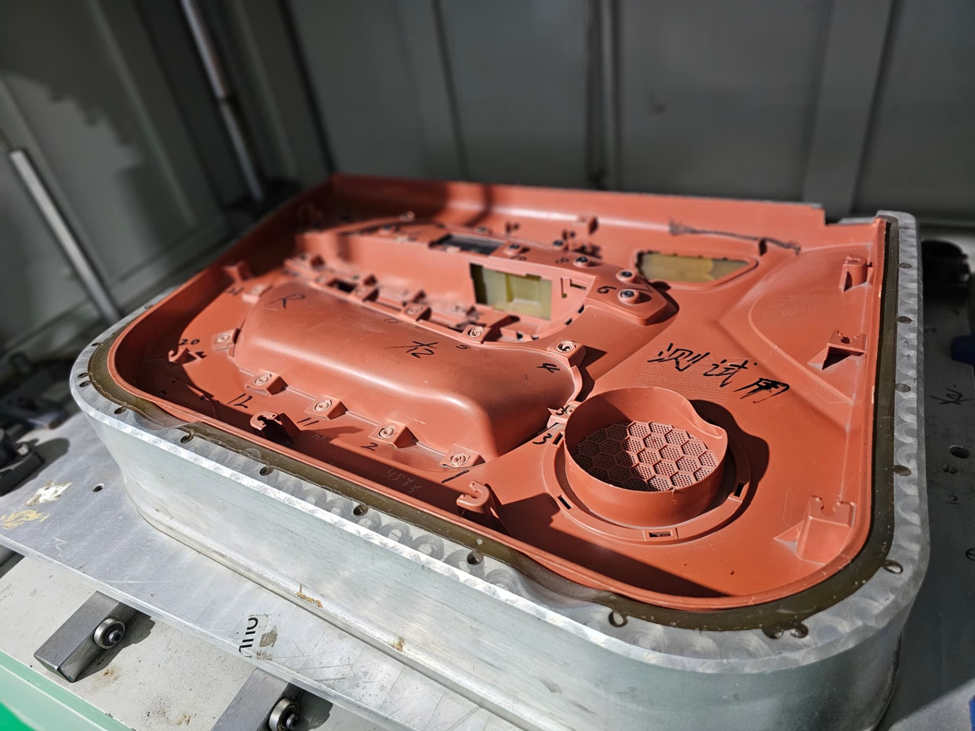 Door panel substrate loaded in an aluminium assembly fixture