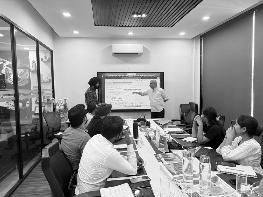Leadership briefing the team on process discipline before a design cycle