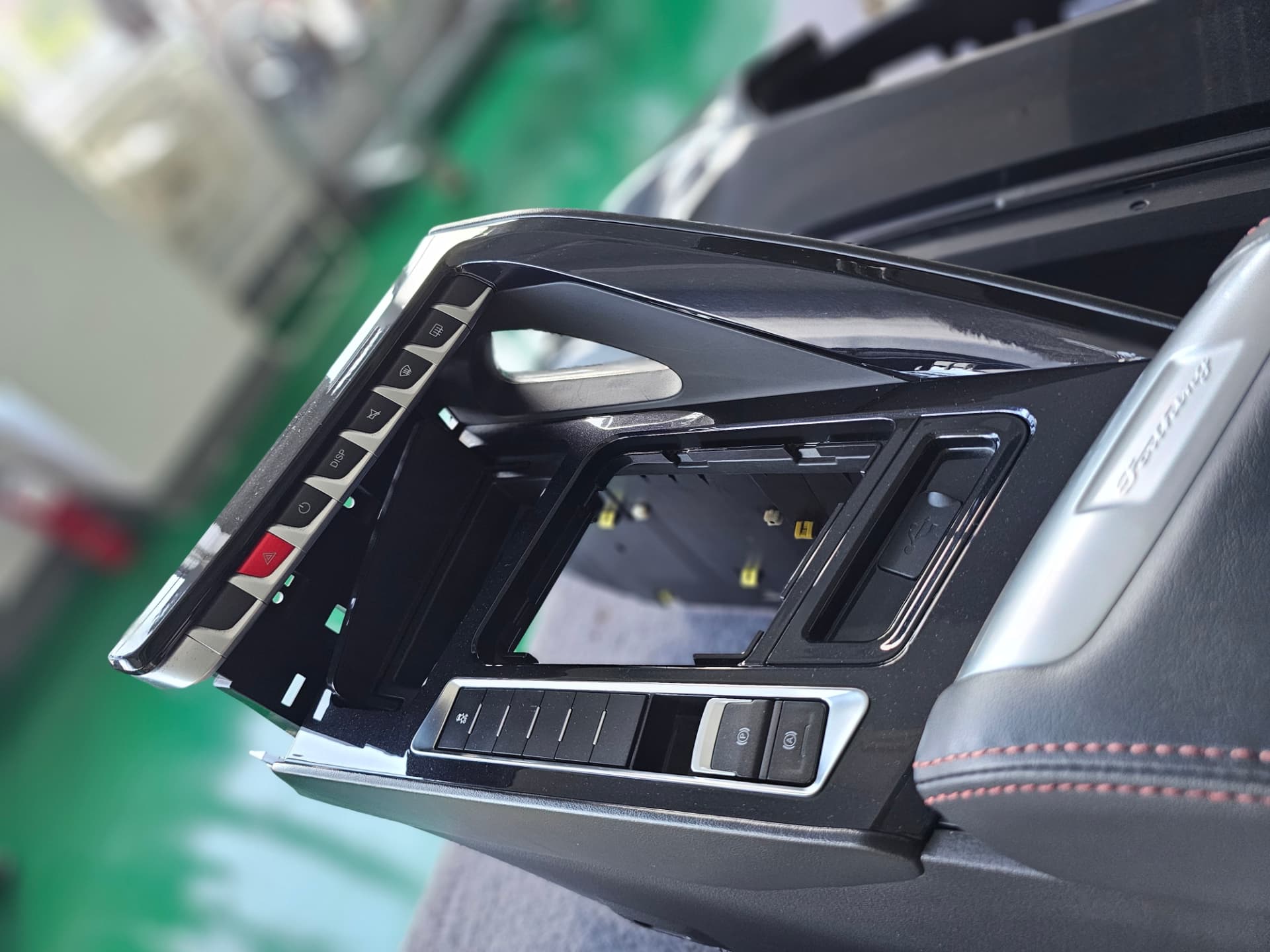Centre console switch panel, gloss and chrome trim detail