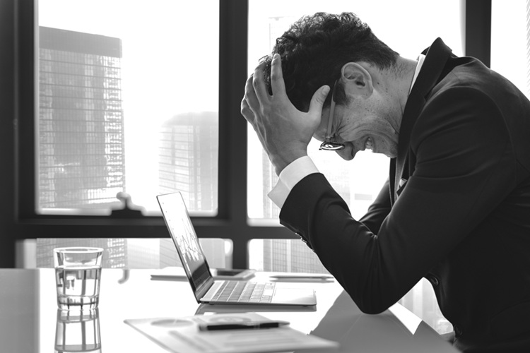 Stressed businessman at desk